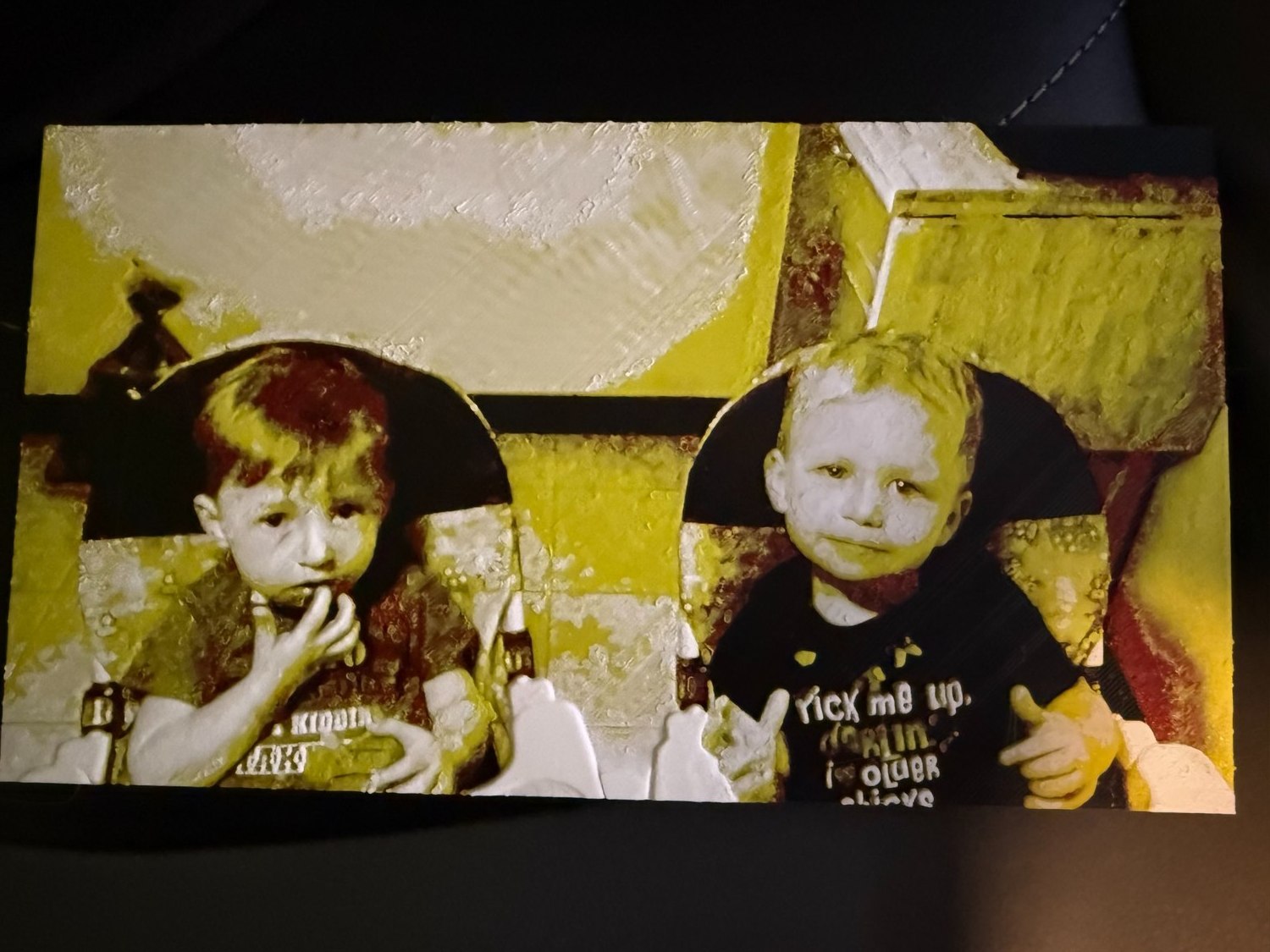 Finished 3D printed portrait of twin boys in high chairs